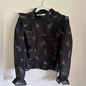 Black and floral sheer blouse in size 12 by H and M